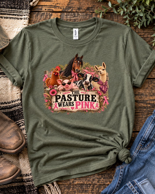 Olive green Pasture Wears Pink breast cancer awareness T-shirt featuring the farm-animal herd and pink lettering on a rustic background.
